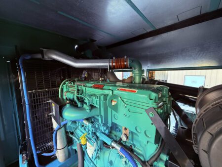 Cummins QSX15-G9 diesel engine inside a 2018 DFEK 500kW generator set, showing radiator and cooling system.