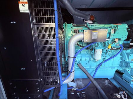 Cummins QSX15 engine and radiator with turbocharger and fuel system inside 2018 Cummins DFEK 500kW generator set.