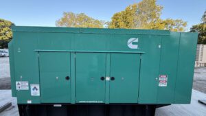 Front view of 2018 Cummins DFEK 500kW generator with enclosure doors closed.