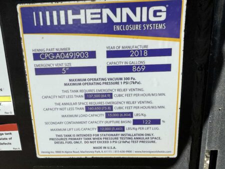Fuel tank label on Hennig Enclosure Systems showing 2018 manufacture date and 869-gallon diesel capacity.