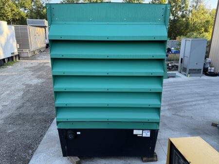 Left-side view of Cummins DFEK 500kW generator set enclosure with ventilation louvers.