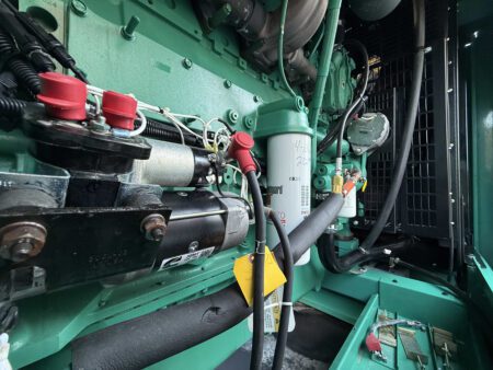 Cummins diesel generator starter motor with connected wiring assembly.