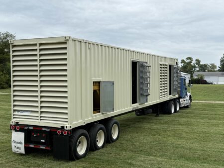 Back-right view of Caterpillar generator enclosure with doors open.