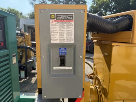 Square D breaker enclosure with radiator fluid pump disconnect on Caterpillar generator