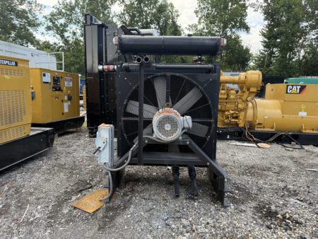 Remote radiator for industrial generator – front view with cooling fan and piping connections.