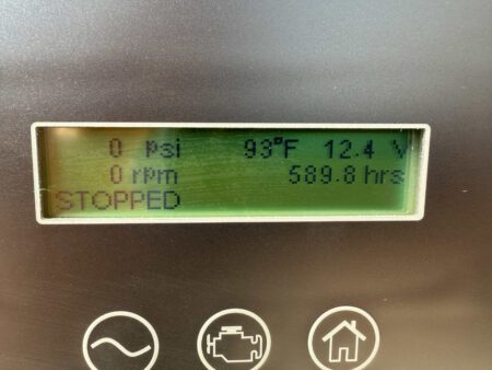 Generator control panel showing 589.8 operating hours, 93°F, and 12.4 volts with status stopped.
