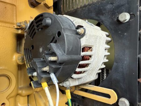 Alternator assembly on CAT C4.4 diesel generator.