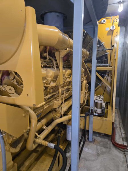 Caterpillar 3516B generator engine side view showing radiator and cooling assembly.
