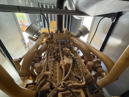 Top view of Caterpillar 3412 V-12 engine with twin turbochargers and air cleaners