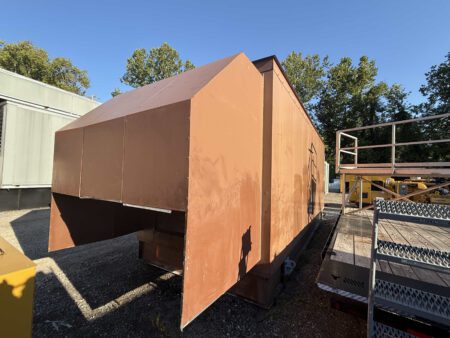 Rear-right side of Caterpillar generator enclosure with service access doors