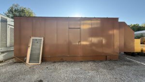 Full front view of Caterpillar generator enclosure in brown finish