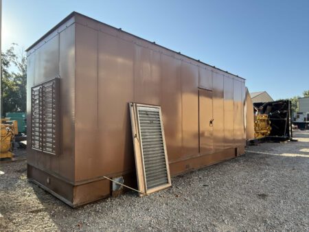 Front-left angle view of Caterpillar generator enclosure with louvers