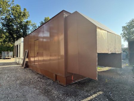 Front-right side view of Caterpillar generator enclosure outdoors