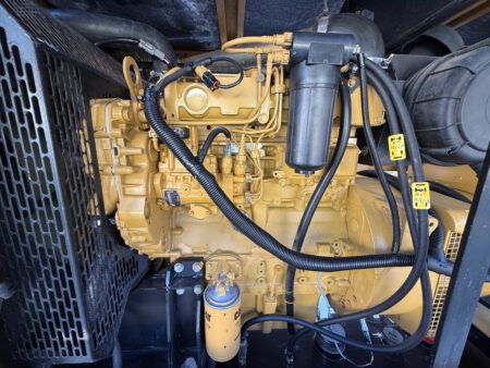 Engine side view of CAT C4.4 diesel generator with Perkins build.