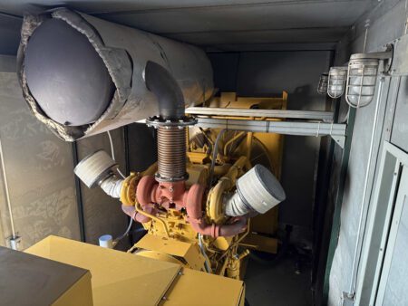 Dual turbochargers and insulated exhaust silencer on Caterpillar 3412 engine