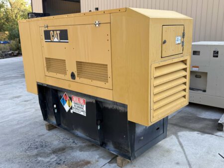 Rear-left view of Caterpillar C4.4 60 kW enclosed generator.