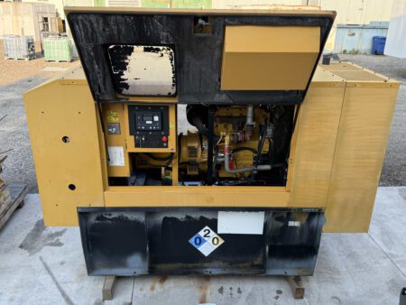Caterpillar C4.4 generator front with enclosure doors open.