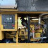 Front interior of Caterpillar C4.4 generator enclosure with engine visible.