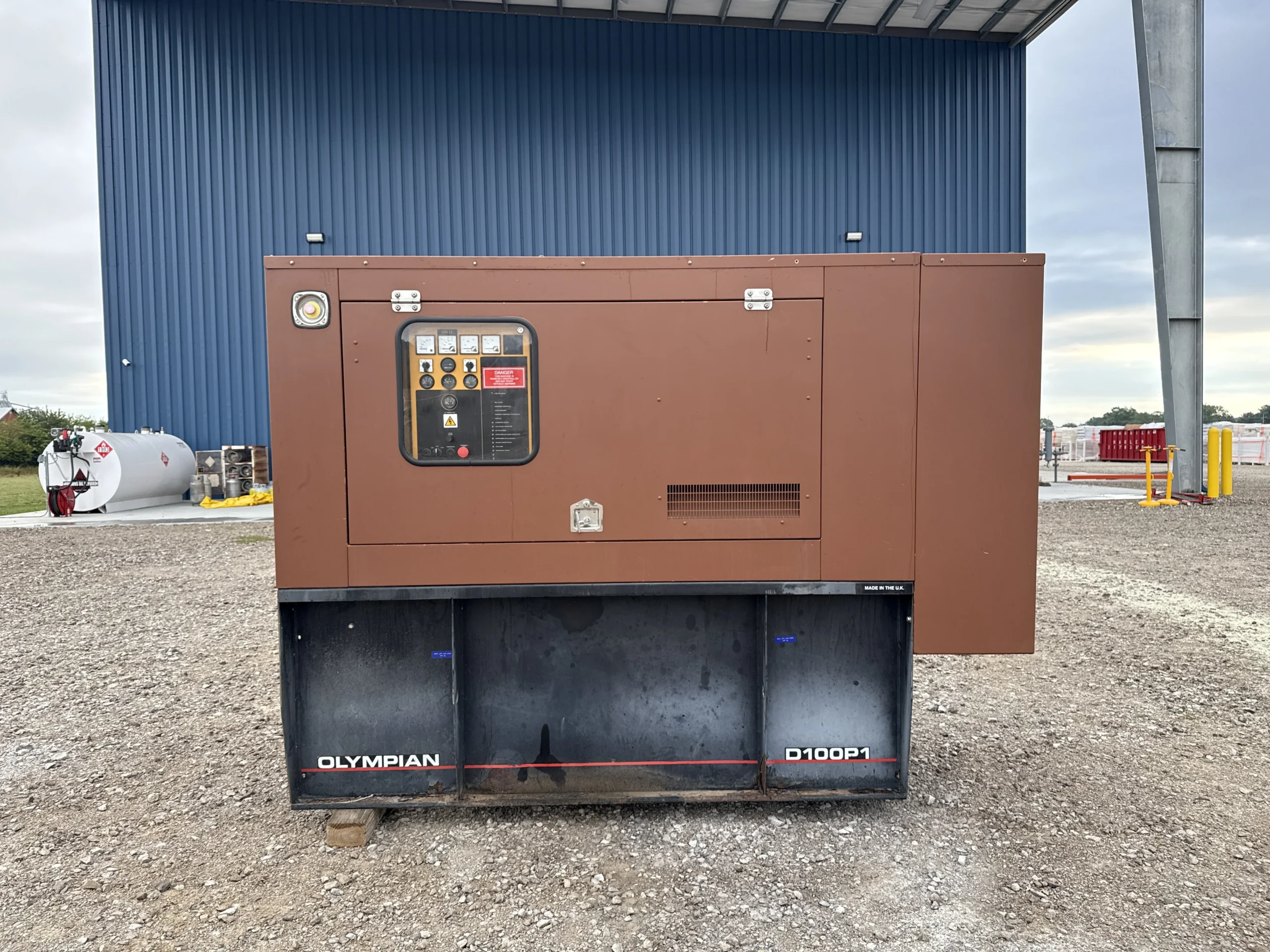 2002-olympian-d100p1-100kw-generator-exterior-front 2002 CAT D100P1 100kW Diesel Generator Set - Image 1